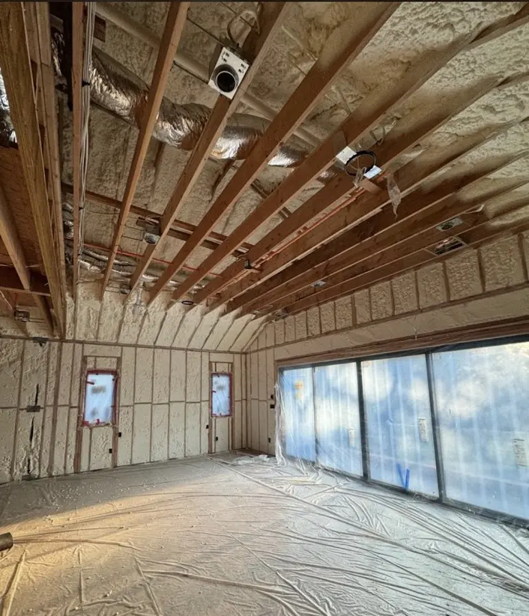 Interior walls and ceiling insulated with spray foam during new construction in Bloomington